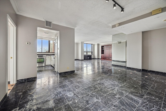 5150 Hidalgo St Unit 1303, Houston, TX 77056 - unfurnished room with marble look tiles, a textured ceiling, and ornamental molding