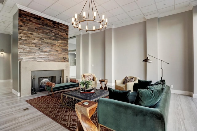 5150 Hidalgo St Unit 1303, Houston, TX 77056 - living room with a chandelier, ornamental molding, and a large fireplace