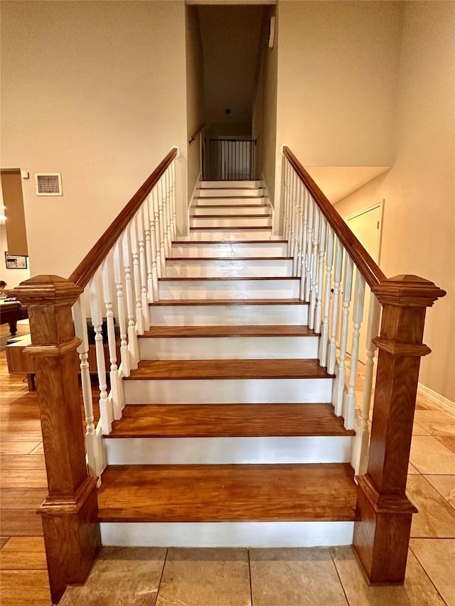 5103 Kleinbrook Dr, Houston, TX 77066 - stairs with a high ceiling and tile patterned floors