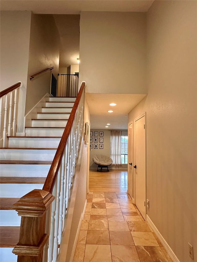 5103 Kleinbrook Dr, Houston, TX 77066 - staircase featuring stone tile flooring and a towering ceiling