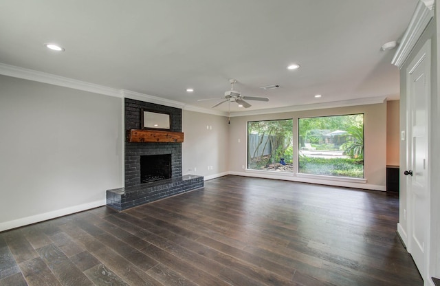 7922 Kleingreen Ln, Spring, TX 77379 - unfurnished living room featuring ornamental molding, dark wood-type flooring, a fireplace, a ceiling fan, and recessed lighting