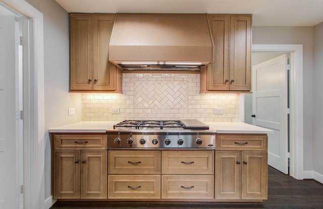 7922 Kleingreen Ln, Spring, TX 77379 - kitchen featuring wall chimney exhaust hood, stainless steel gas cooktop, light countertops, and decorative backsplash
