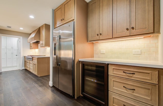 7922 Kleingreen Ln, Spring, TX 77379 - kitchen with appliances with stainless steel finishes, beverage cooler, wall chimney exhaust hood, dark wood-type flooring, and recessed lighting