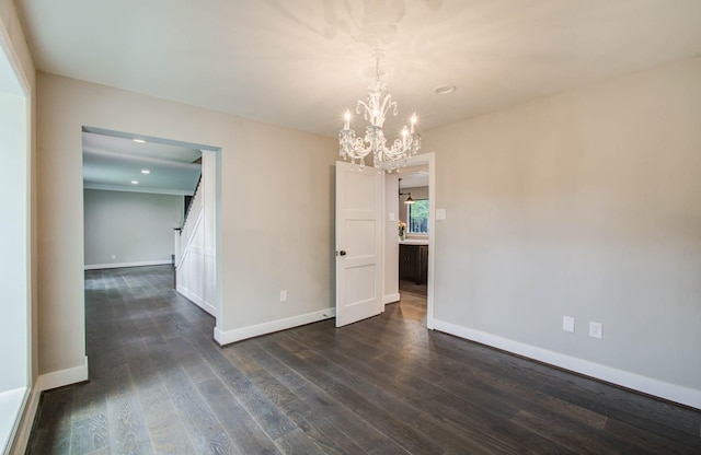 7922 Kleingreen Ln, Spring, TX 77379 - empty room featuring a chandelier, dark wood-type flooring, and recessed lighting