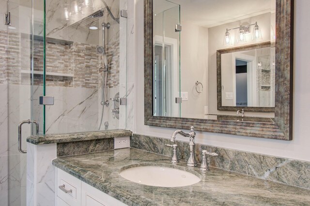 7922 Kleingreen Ln, Spring, TX 77379 - full bathroom featuring vanity and a marble finish shower