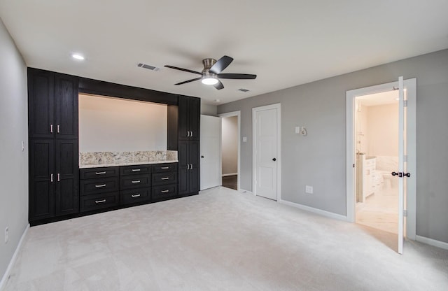 7922 Kleingreen Ln, Spring, TX 77379 - unfurnished bedroom featuring light carpet, ensuite bath, and ceiling fan