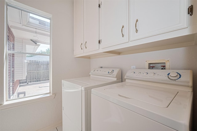 9726 Parmer Ct, Houston, TX 77064 - washroom with washer and dryer and cabinet space