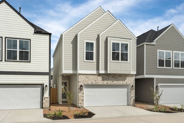 416 Stonework Landing Ln, Houston, TX 77076 - view of front facade with brick siding, an attached garage, and driveway