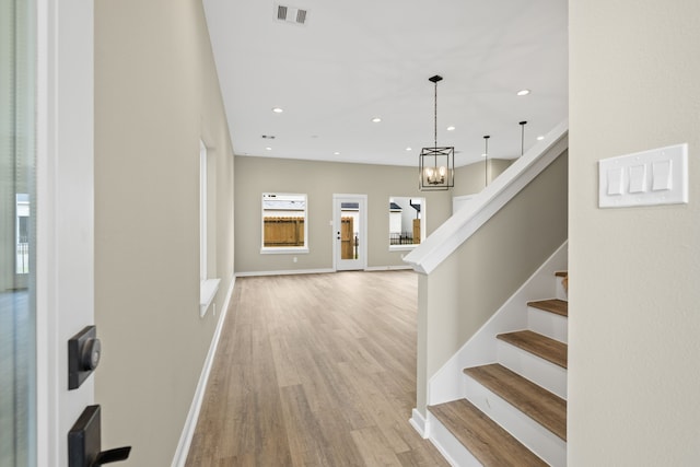 416 Stonework Landing Ln, Houston, TX 77076 - foyer entrance featuring light wood finished floors, stairway, recessed lighting, and a chandelier