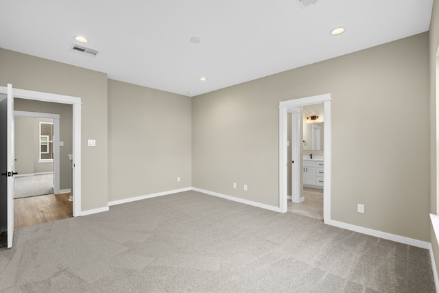 416 Stonework Landing Ln, Houston, TX 77076 - unfurnished bedroom featuring carpet floors, recessed lighting, and ensuite bathroom