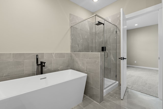 416 Stonework Landing Ln, Houston, TX 77076 - bathroom featuring a freestanding bath, a shower stall, and recessed lighting