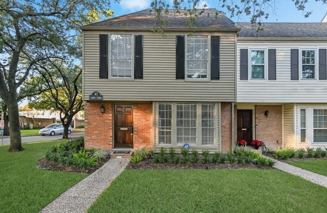 13050 Trail Hollow Dr, Houston, TX 77079 - view of front of house with brick siding and a front lawn