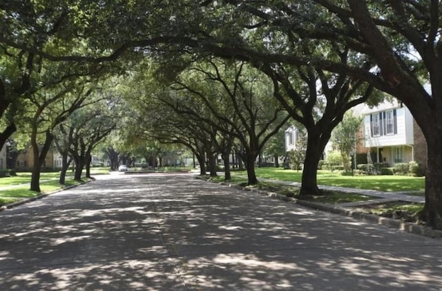 13050 Trail Hollow Dr, Houston, TX 77079 - view of asphalt street with curbs and sidewalks