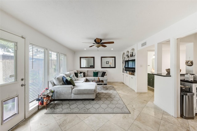 13050 Trail Hollow Dr, Houston, TX 77079 - living room with ceiling fan and light tile patterned floors