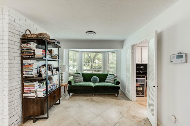 13050 Trail Hollow Dr, Houston, TX 77079 - living area with light tile patterned floors and wine cooler