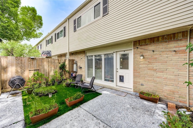 13050 Trail Hollow Dr, Houston, TX 77079 - back of house featuring a patio area, brick siding, and a garden