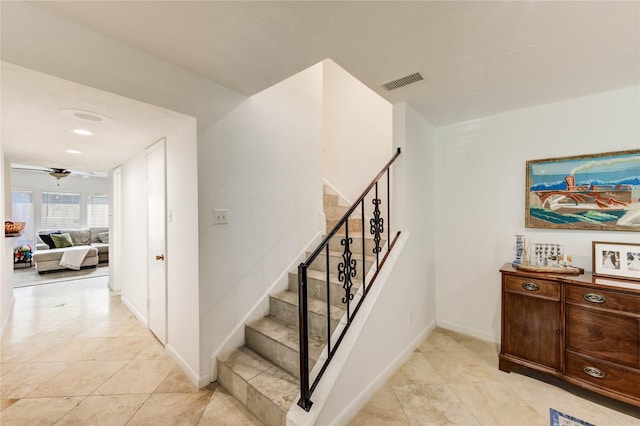13050 Trail Hollow Dr, Houston, TX 77079 - stairway featuring a ceiling fan and tile patterned flooring