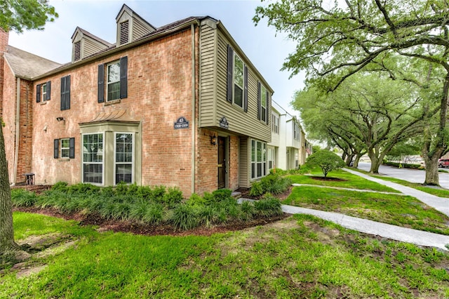 13050 Trail Hollow Dr, Houston, TX 77079 - view of property exterior with brick siding and a yard