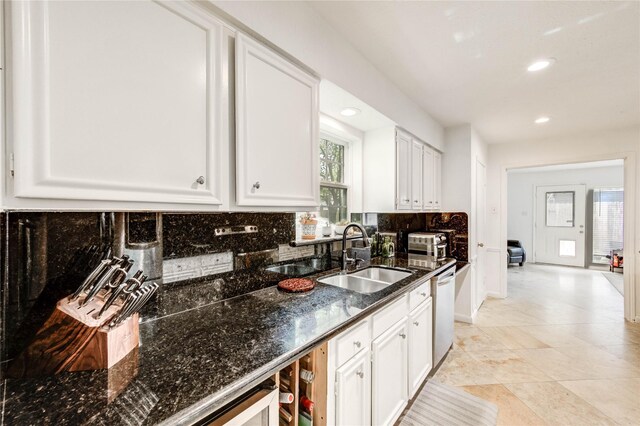 13050 Trail Hollow Dr, Houston, TX 77079 - kitchen with backsplash, white cabinets, dishwasher, recessed lighting, and dark stone counters