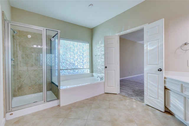 5507 Opal Cove Ct, Katy, TX 77494 - bathroom featuring a garden tub, tile patterned flooring, a shower stall, and vanity
