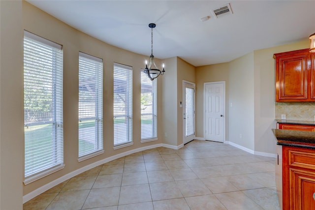 5507 Opal Cove Ct, Katy, TX 77494 - unfurnished dining area featuring a chandelier and light tile patterned floors
