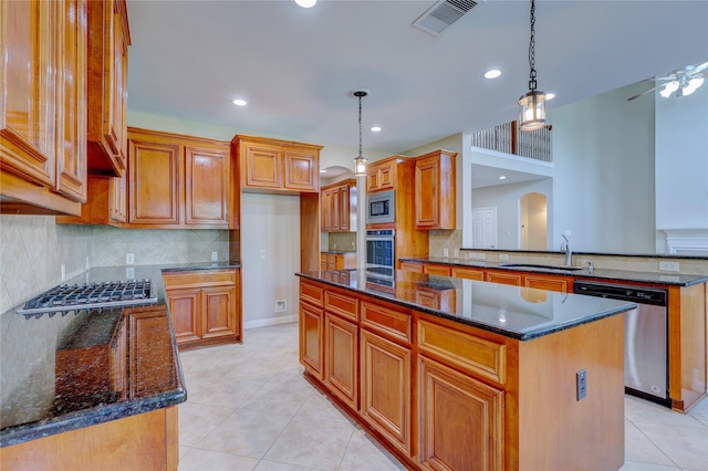 5507 Opal Cove Ct, Katy, TX 77494 - kitchen featuring stainless steel appliances, a kitchen island, backsplash, dark stone counters, and recessed lighting