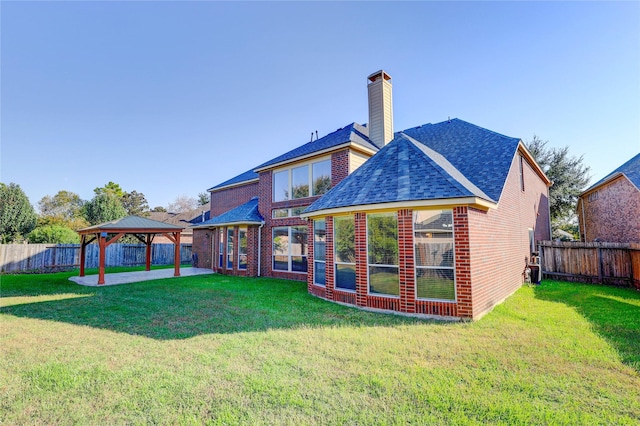 5507 Opal Cove Ct, Katy, TX 77494 - back of house featuring a gazebo, a patio, a fenced backyard, roof with shingles, and a chimney