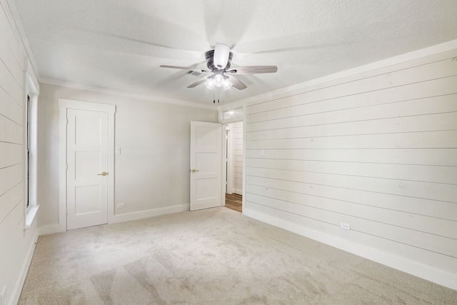 707 N Main St, Dayton, TX 77535 - unfurnished bedroom featuring carpet, baseboards, and a ceiling fan