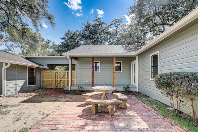 707 N Main St, Dayton, TX 77535 - view of patio featuring a gate
