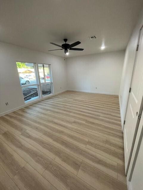 1221 N Hamilton St, Gonzales, TX 78629 - unfurnished room with light wood finished floors and ceiling fan