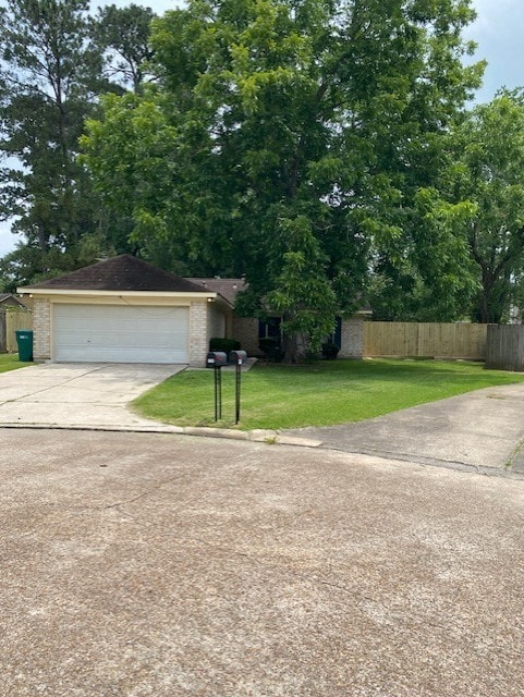 3538 Dryburgh Ct, Huffman, TX 77336 - view of front facade featuring a garage, brick siding, and concrete driveway