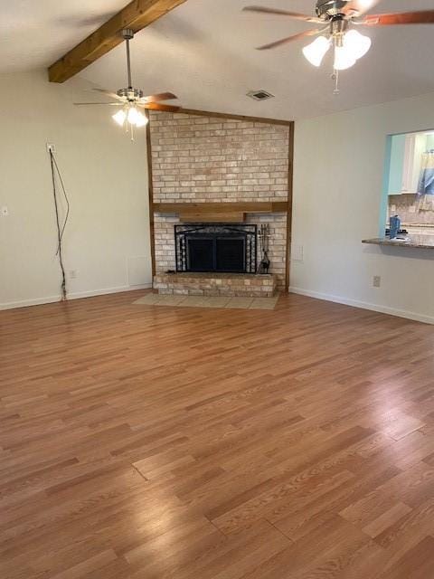 3538 Dryburgh Ct, Huffman, TX 77336 - unfurnished living room with a ceiling fan, wood finished floors, and a fireplace