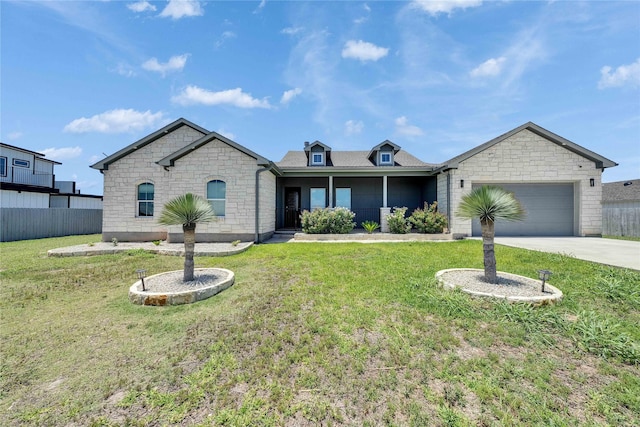 108 Bianca Cir, Del Valle, TX 78617 - view of front facade with stone siding, a garage, and driveway