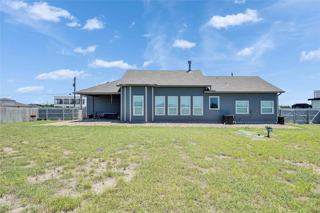 108 Bianca Cir, Del Valle, TX 78617 - rear view of house with a fenced backyard and a shingled roof