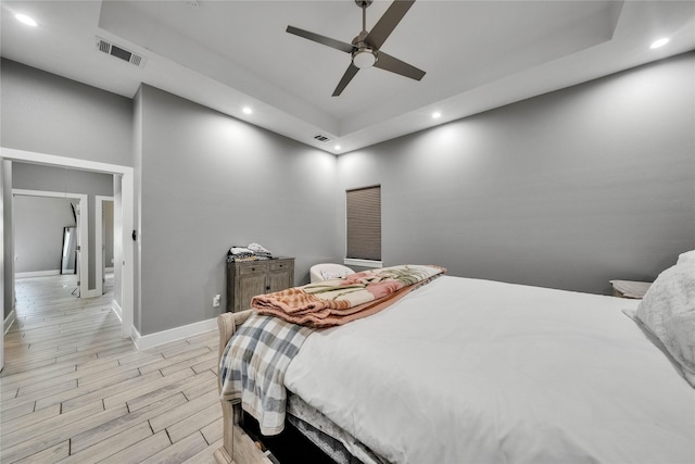 108 Bianca Cir, Del Valle, TX 78617 - bedroom with recessed lighting, a raised ceiling, light wood finished floors, and a ceiling fan