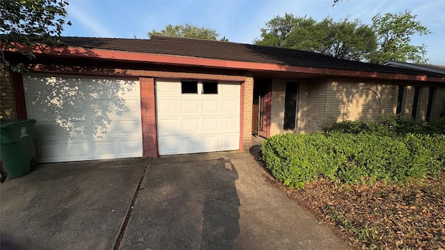 12414 Frazier River Dr, Houston, TX 77050 - view of front of home featuring driveway, brick siding, and an attached garage