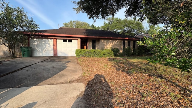 12414 Frazier River Dr, Houston, TX 77050 - ranch-style home featuring a garage, concrete driveway, and brick siding