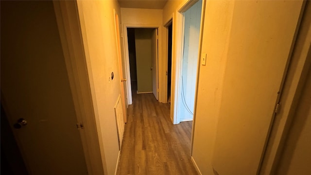 12414 Frazier River Dr, Houston, TX 77050 - hallway featuring wood finished floors and baseboards