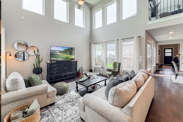 1206 Raburn Run Ln, Tomball, TX 77375 - living room with a high ceiling, healthy amount of natural light, ceiling fan, and hardwood / wood-style flooring
