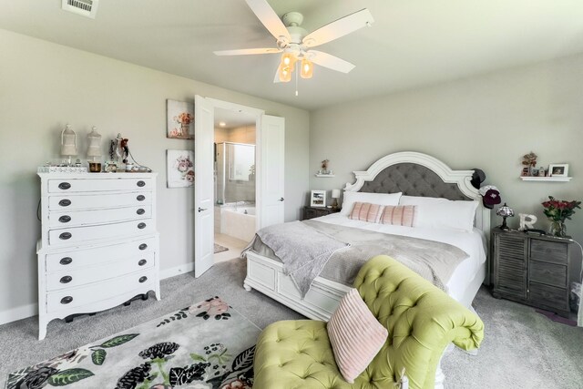 1206 Raburn Run Ln, Tomball, TX 77375 - carpeted bedroom with connected bathroom and ceiling fan