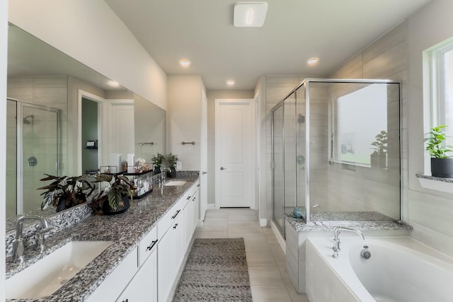 1206 Raburn Run Ln, Tomball, TX 77375 - full bathroom with double vanity, a shower stall, a bath, tile patterned flooring, and recessed lighting