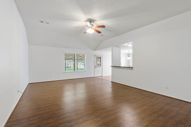 7023 Hayden Dr, Magnolia, TX 77354 - empty room with ceiling fan, vaulted ceiling, and wood finished floors