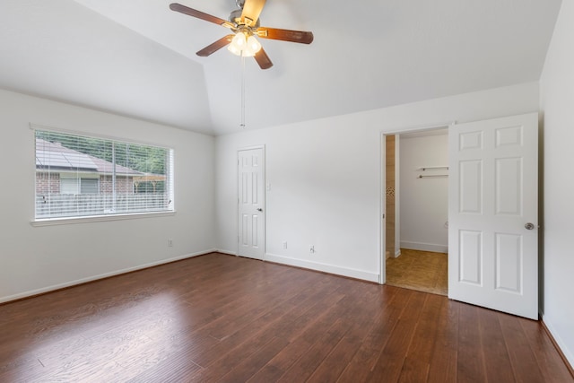 7023 Hayden Dr, Magnolia, TX 77354 - unfurnished bedroom with lofted ceiling, dark wood-style floors, a ceiling fan, and a closet