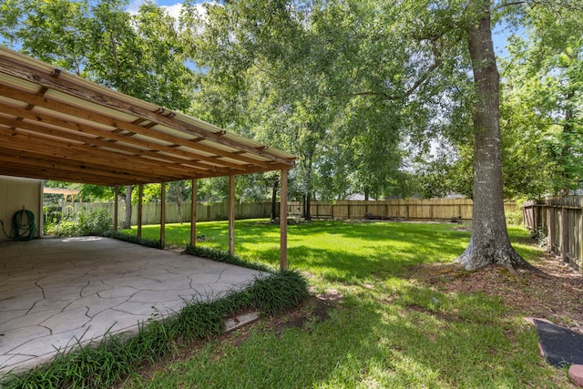 7023 Hayden Dr, Magnolia, TX 77354 - fenced backyard with a patio area