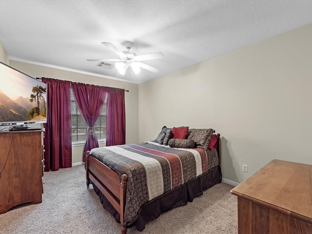247 Private Road 635, Dayton, TX 77535 - bedroom with light colored carpet, a ceiling fan, and a textured ceiling