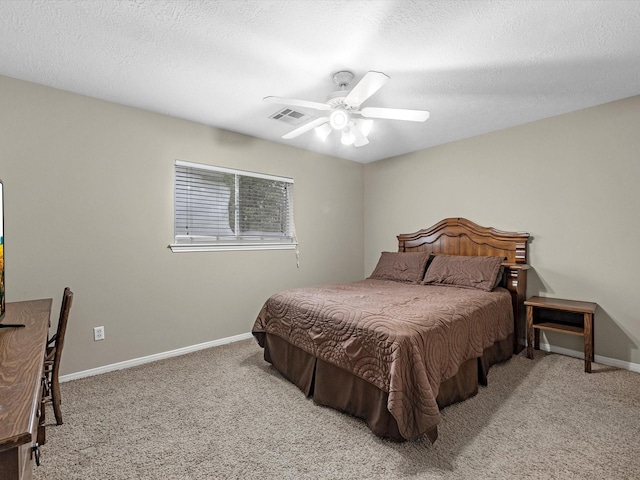 247 Private Road 635, Dayton, TX 77535 - bedroom featuring carpet flooring, ceiling fan, and a textured ceiling