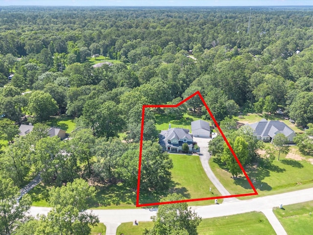 247 Private Road 635, Dayton, TX 77535 - aerial overview of property's location featuring a heavily wooded area and property parcel outlined