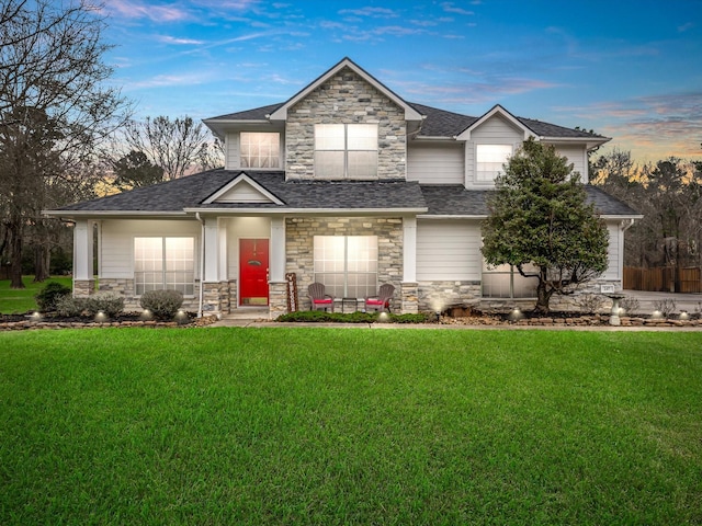 247 Private Road 635, Dayton, TX 77535 - view of front facade featuring stone siding, a front lawn, and a shingled roof