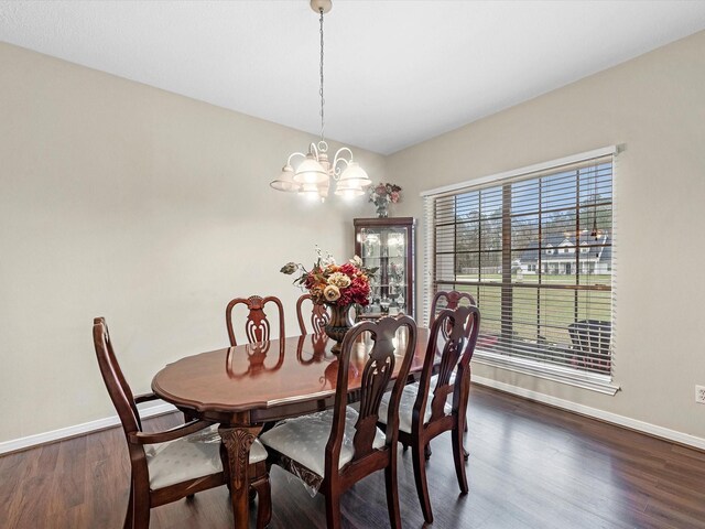 247 Private Road 635, Dayton, TX 77535 - dining room with a chandelier and dark wood-style flooring