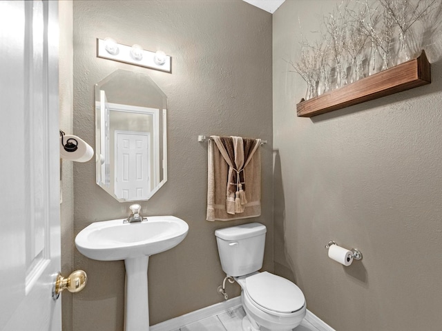247 Private Road 635, Dayton, TX 77535 - half bathroom with toilet and marble finish floors
